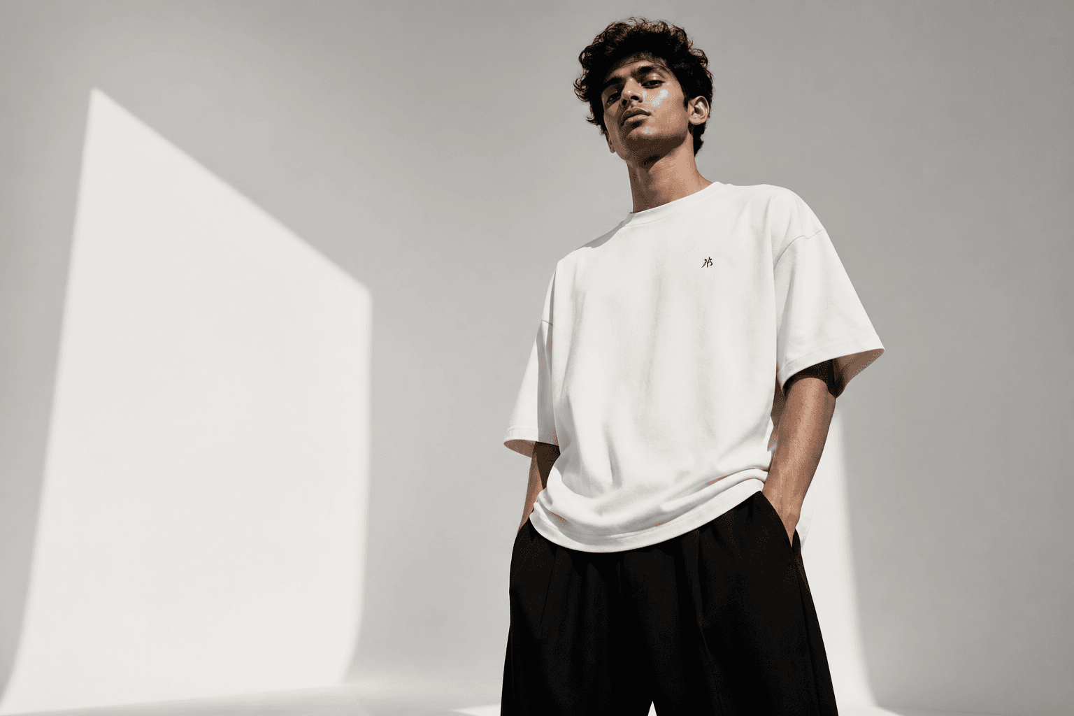 Model wearing an off-white oversized ABHIJAY T-shirt